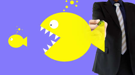 businessman is drawing the concept of big fish eating the little fish writing on a wipeboard. All screen content is designed by me and not copyrighted by others and created with wacom tablet and psの写真素材