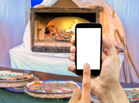 Man is calling the pizza through service online with the smartphoneの写真素材