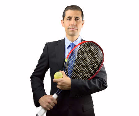 portrait of business man holding a racket tennis against white backgroundの写真素材