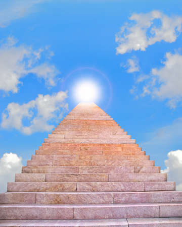 Stairway leading up to bright lightの写真素材