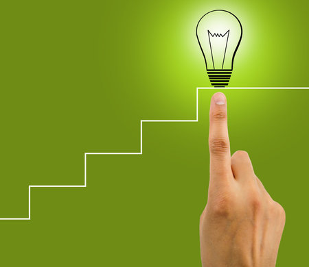 hand is touching the bulb at the final of stairs as concept of creation of a genial idea. All screen...