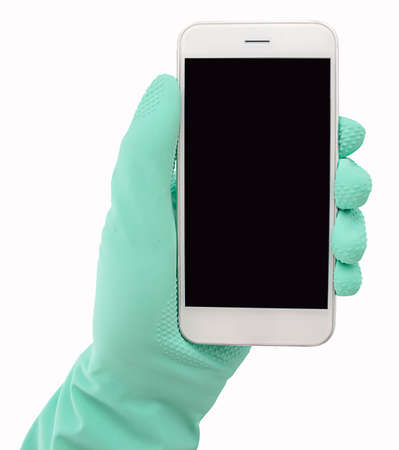 cleaning worker holding the smartphoneの写真素材