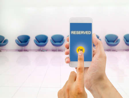 man vip seat reserved for an event with the smartphoneの写真素材
