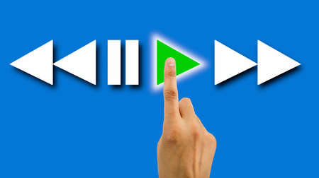 hand pressed to play the video with blue backgroundの写真素材