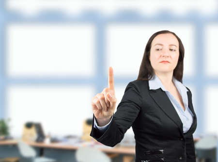 businesswoman pointing the whiteboard at the office with focus on the fingerの写真素材