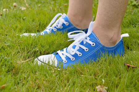 profile view of blue sneaker isolated on a grassの写真素材