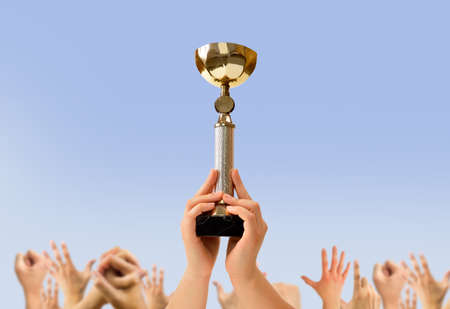 men sports player holding his trophy after winning a matchの写真素材