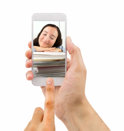 Man photographing an administrative employee asleep on the jobの写真素材