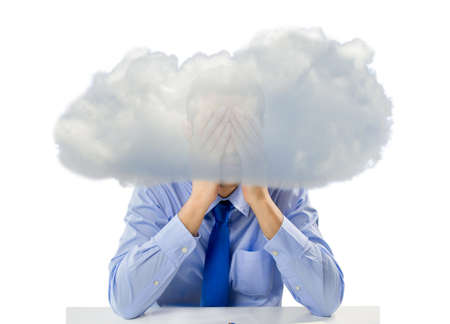 businessman stressed out with a cloud in the head and hands in the face with white backgroundの写真素材