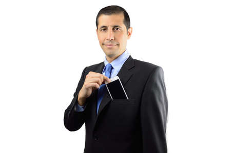 Cropped shot of a businessman putting his phone at his pocket jacket isolated on white backgroundの写真素材