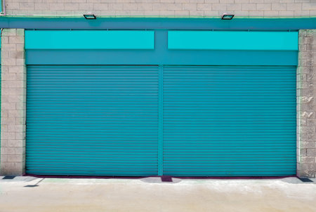 A blank metal shutter door, with space for text, on a modern urban commercial shop at outdoors