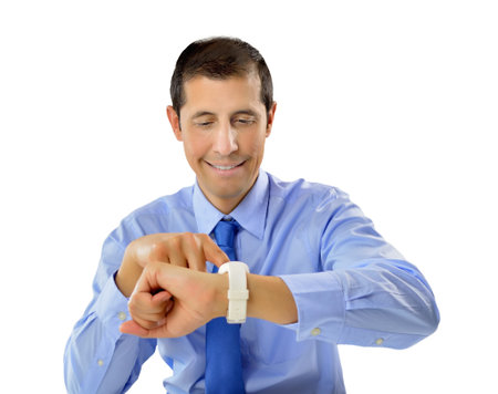 happy businessman looking at his wristwatch and smiling on white background