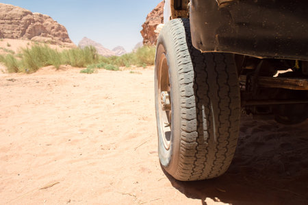 closeup of the wheel of a 4x4 in a desert