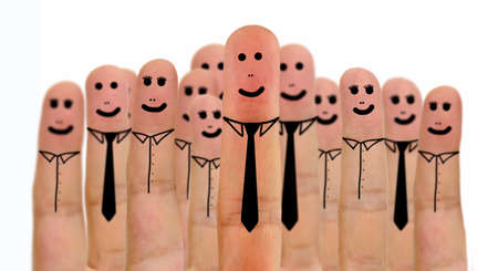 Close-up of businessman and businesswoman on fingers with smiley face and isolated on white backgroundの写真素材
