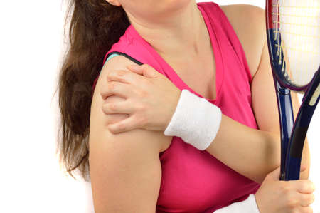 Shot of a tennis player with a shoulder injury isolated over white backgroundの写真素材
