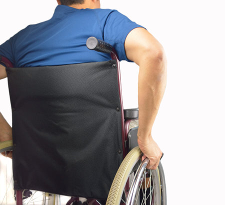 back of a man in wheelchair with a white background