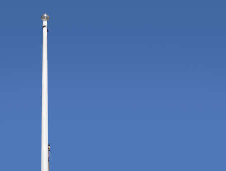 White mast of single flag and without flag with copy spaceの写真素材