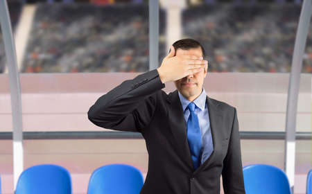 Shot of a Coach looking disappointed after a game of soccer.Concept of sport failure or defeatの写真素材