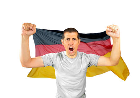 Man supporters at stadium screaming for the victory with germany flag isolatedの写真素材