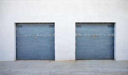 group of many storage warehouse building with a group closed doors. Storage roomの写真素材