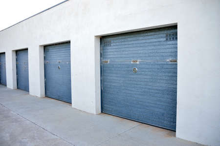 group of many storage warehouse building with a group closed doors. Storage roomの写真素材