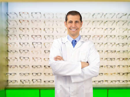 Portrait of a confident man optometrist standing in his storeの写真素材