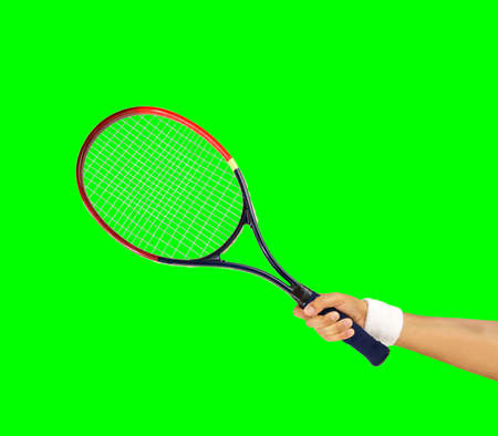 hand holding a tennis racket isolated cutout on green background with chroma key の写真素材