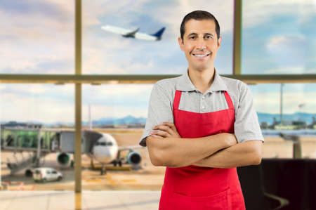 portrait of shopman at airport departure loungeの写真素材
