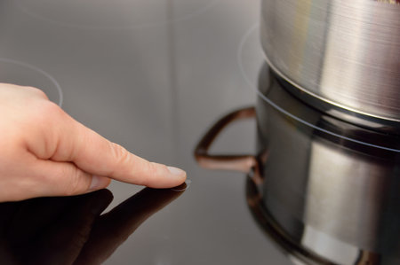 Woman select function on Induction stove