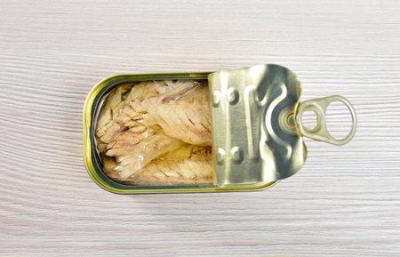 High angle shot of delicious canned mackerel on rustic wooden table