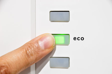 finger activating the eco button in concept of clean energy and save