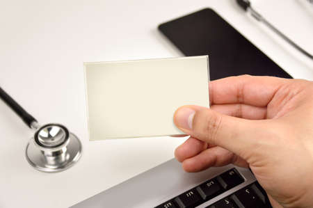Shot of a hand doctor holding up a blank sign for copyの写真素材