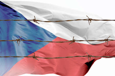 Metal fence with barbed wire on a Czech flag. Separation concept, borders protection.Social issues on refugees or illegal immigrantsの写真素材