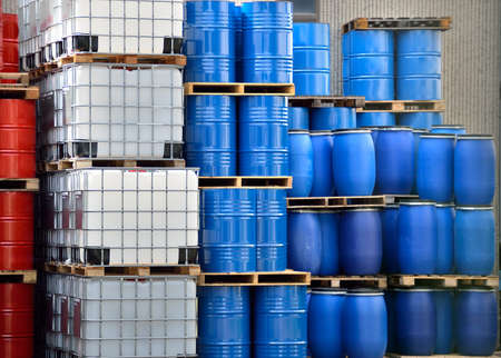 Shot of stacked containers in a large distribution warehouseの写真素材