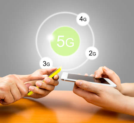 two people with the phone and connected to social networks with 5g and gray background. All screen content is designed by my and not copyrighted by others and created with digitizing tablet and image editorの写真素材