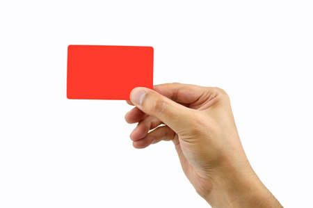 hand of businessman showing red card with copy space and white backgroundの写真素材