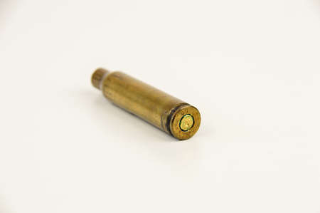 bullet casing of kalashnikov isolated on white backgroundの写真素材