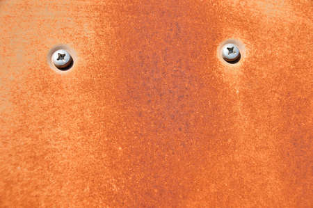 Shot of a rusty metal with screws and dirtyの写真素材