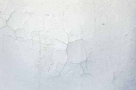 white wall cracked with moistureの写真素材