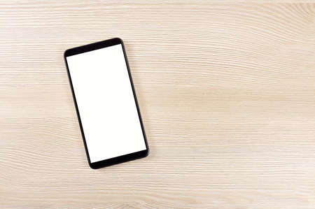 High angle shot of a table and phone with copy spaceの写真素材