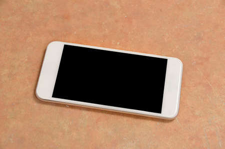 High angle shot of a floor and phone with copy spaceの写真素材