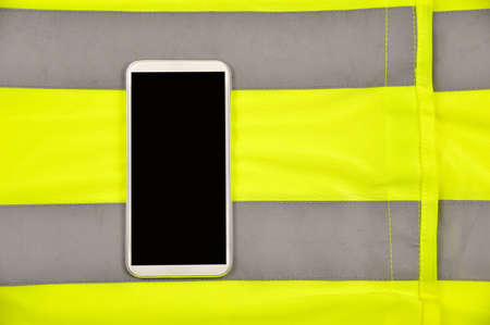 phone with yellow shirt on emergency call conceptの写真素材