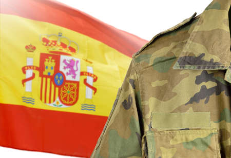 Military man posing in front of Spain flagの写真素材