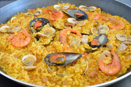 close up a traditional spanish rice paella with sea foodの写真素材