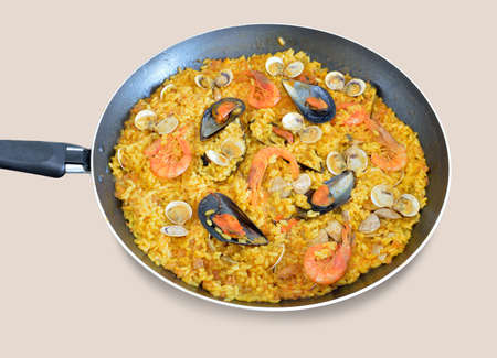 close up a traditional spanish rice paella with sea food and white backgroundの写真素材