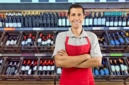 Portrait of cheerful young employee at a winery looking at camera smilingの写真素材