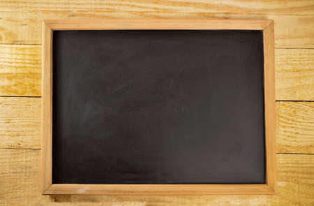 Chalkboard empty blank y copy space with wood backgroundの写真素材