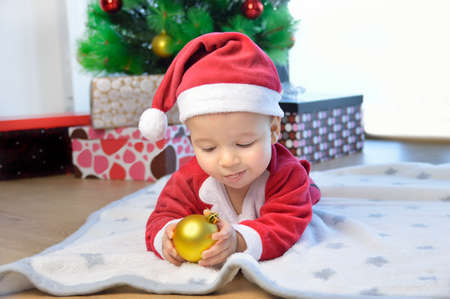 funny baby boy weared in Santa hatの写真素材