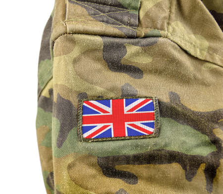 Cropped closeup shot of a UK flag on a soldier's uniform with white backgroundの写真素材