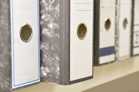 Many lever arch files on a bookshelvesの写真素材